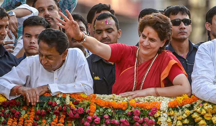 Congress General Secretary Priyanka Gandhi Vadra with Madhya Pradesh Chief Minister Kamal Nath (left) during a roadshow in Indore | PTI