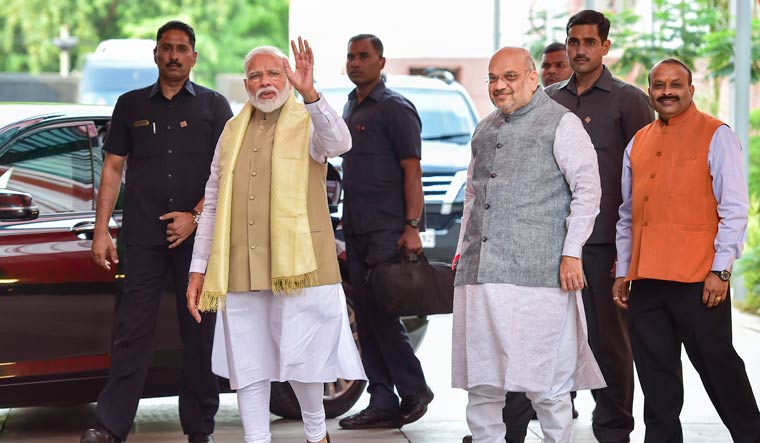 Prime Minister Narendra Modi and BJP president Amit Shah arrive for a meeting with the Union Council of Ministers at BJP Headquarters, in New Delhi | PTI