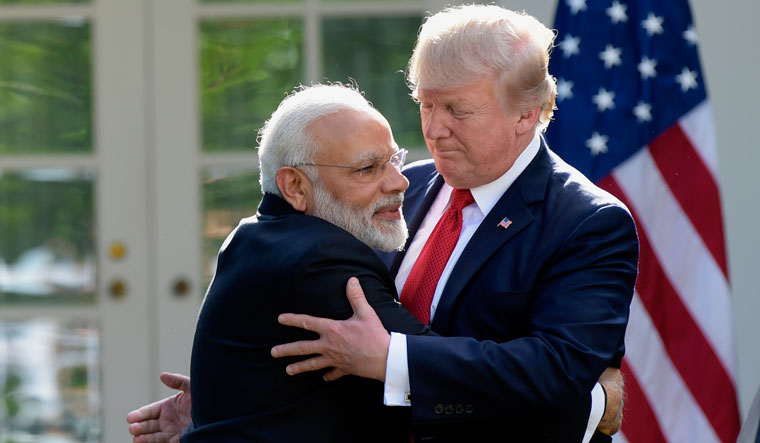 [File] Prime Minister Narendra Modi and US President Donald Trump hug while making statements in the Rose Garden of the White House in Washington in June 2017 | AP