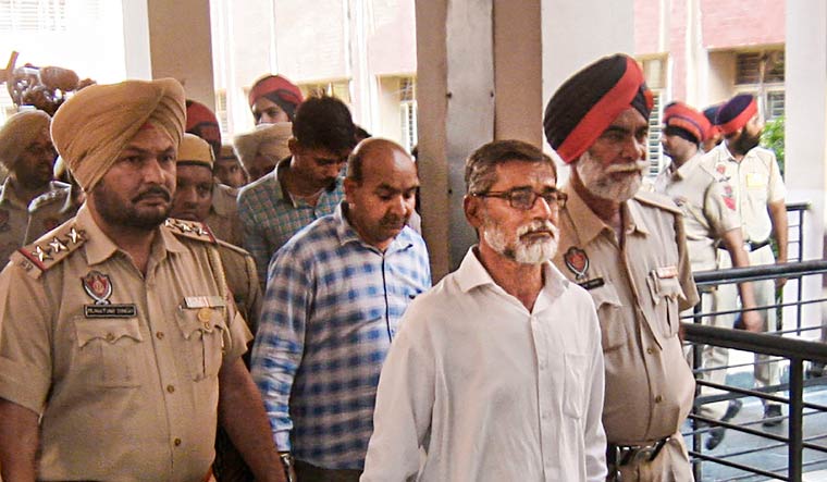 Kathua rape case main convict Sanjhi Ram along with other convicts being taken to the District and Sessions Court for the pronouncement of the quantum of punishment in Pathankot | PTI