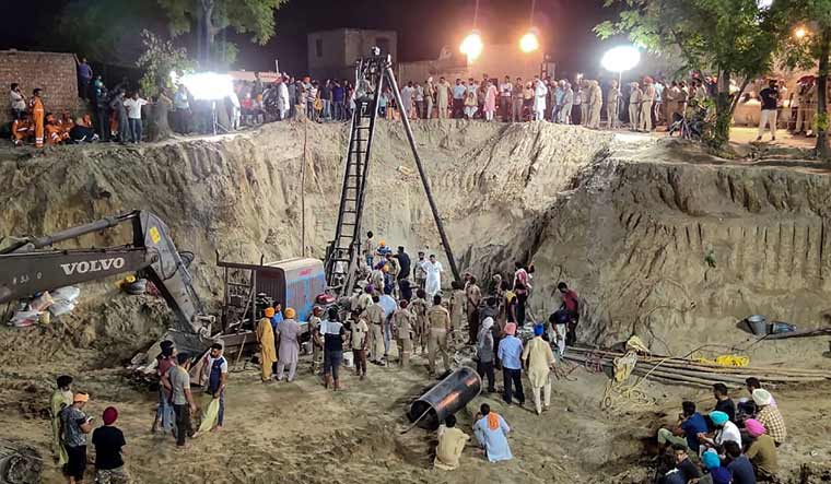 Rescue operation underway on Monday to recover the body of Fatehveer Singh, 2, who fell in a 33-metre deep well on June 6, in Sunam in the Punjab district of Sangrur | AFP