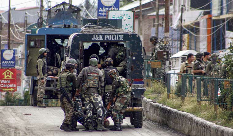 An injured CRPF jawan being shifted by his colleagues from the site of 'Fidayeen' attack in Anantnag | PTI