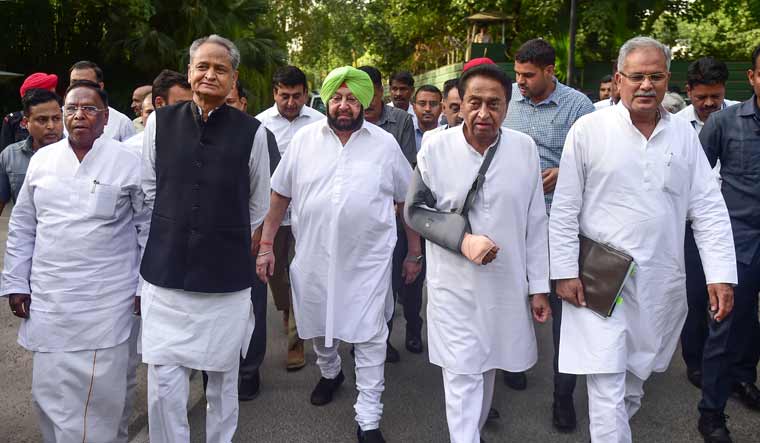 Congress Chief Ministers Ashok Gehlot of Rajasthan, Kamal Nath of Madhya Pradesh, Amarinder Singh of Punjab, Bhupesh Baghel of Chhattisgarh and V Narayanasamy of Puducherry leave after meeting party president Rahul Gandhi at his Tughlak Lane residence in New Delhi | PTI