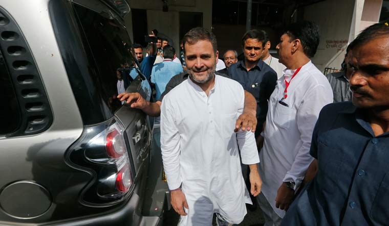 Congress party leader Rahul Gandhi leaves after appearing before a court in Ahmadabad | AP