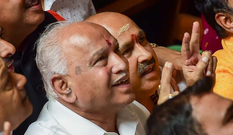 BJP state president B.S. Yeddyurappa with his party MLAs show victory sign after HD Kumaraswamy lost the vote of confidence at Vidhana Soudha | PTI