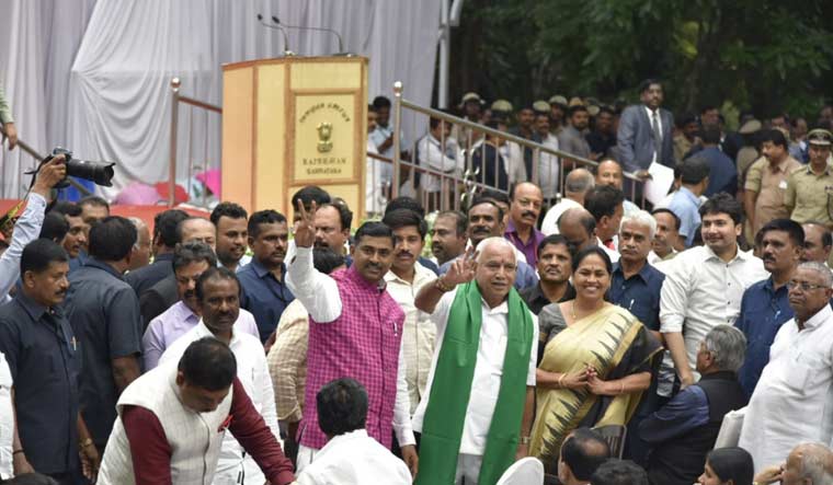 Yediyurappa greets party leaders as he arrives to take oath of office as the chief minister of Karnataka, in Bengaluru | Prathima Nandakumar