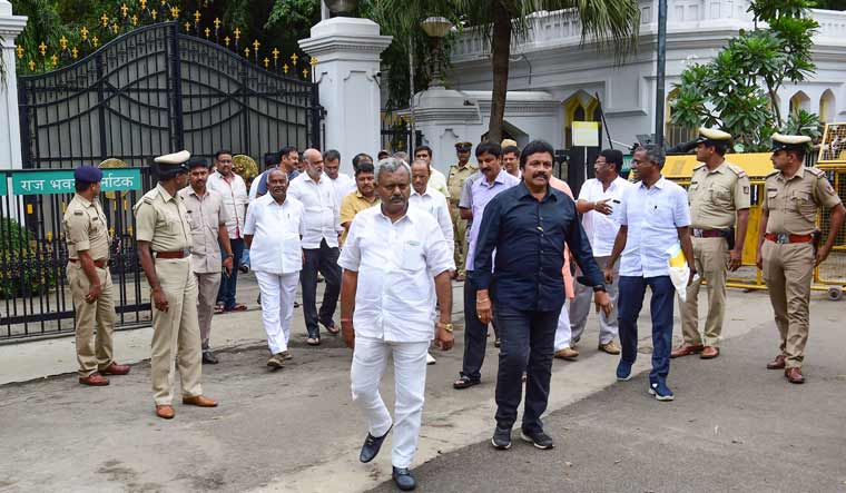 Dissident MLAs from JD(S) and Congress leave Raj Bhavan after meeting with Karnataka Governor Vajuibhai Vala, in Bengaluru | PTI