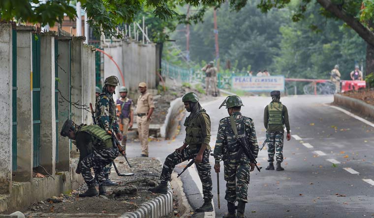 Security personnel inspect the area near Sher-e-Kashmir Cricket Stadium, in Srinagar | PTI