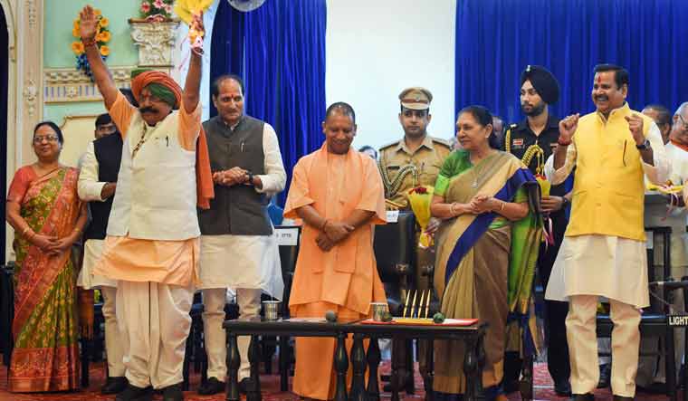Uttar Pradesh Governor Anandiben Patel and Chief Minister Yogi Adityanath with the newly inducted ministers | PTI