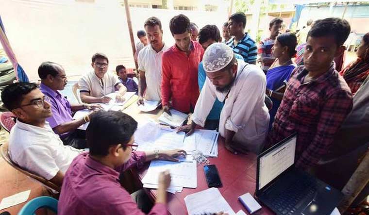[File] National Register of Citizens officials checking documents of residents in Nagaon district of Assam | PTI