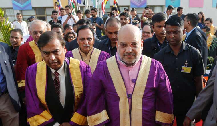 Home Minister Amit Shah and Reliance Group chairman Mukesh Ambani arrive to attend a convocation ceremony at the Pandit Deendayal Petroleum University in Gandhinagar| AP