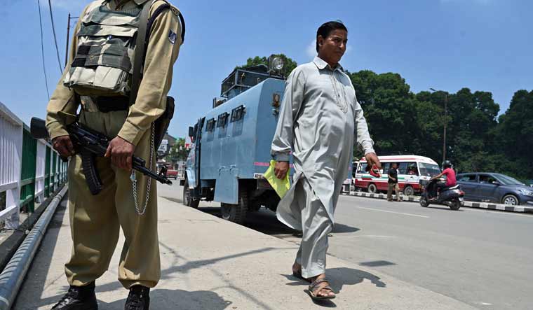 An Indian paramilitary trooper stands guard in Srinagar | AFP