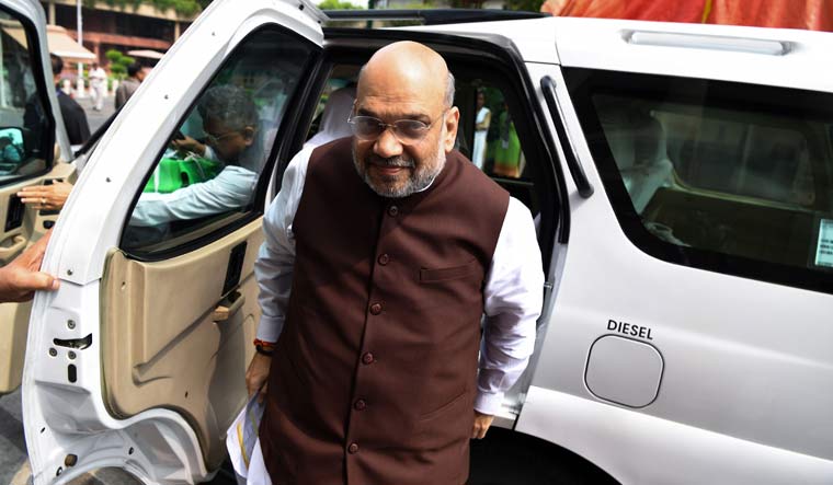 Home Minister Amit Shah arrives at the parliament house in New Delhi | AFP