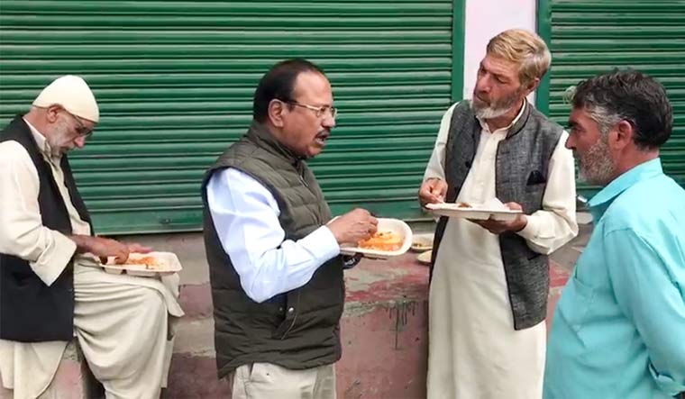 National Security Adviser Ajit Doval interacts with the local residents while reviewing the security situation in Shopian | PTI