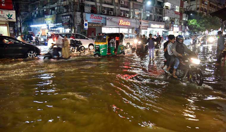 A view of a flooded street at Himayat Nagar, after heavy downpour in Hyderabad | PTI