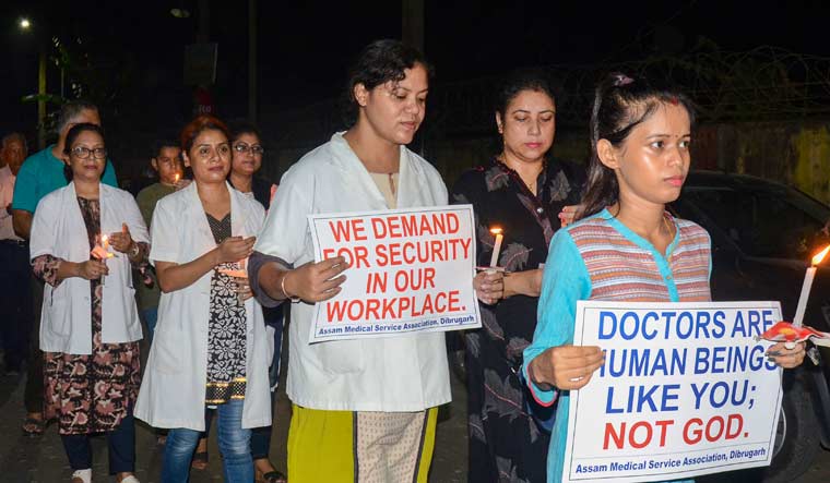 Assam Medical College & Hospital Teachers Association and the Assam wing of the IMA take out a candle protest rally against the alleged assault on Deben Dutta in Dibrugarh | PTI