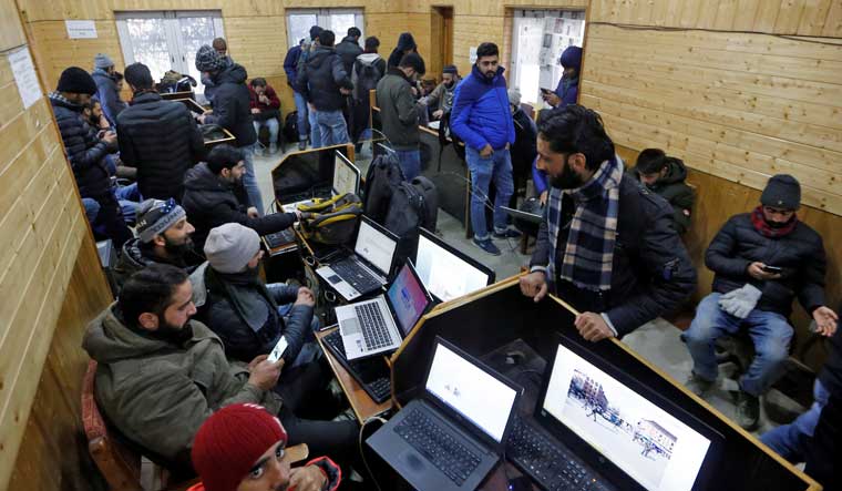 Journalists use the internet as they work inside a government-run media centre in Srinagar January 10, 2020 | Reuters