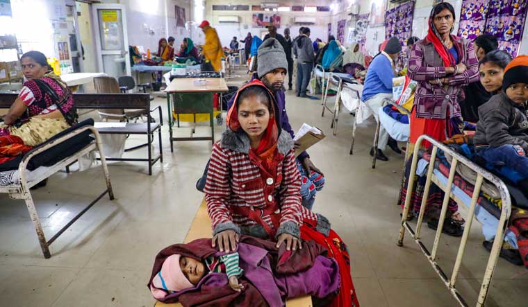 A mother waits for treatment of her child at the JK Lone hospital in Kota | PTI