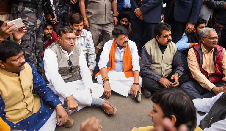 BJP General Secretary Kailash Vijayvargiya (centre) along with supporters stage a protest against the state Congress government in Indore | PTI