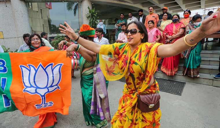 BJP supporters react during counting day of Madhya Pradesh Assembly bypolls, at party HQ in Bhopal | PTI