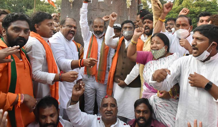 Telangana BJP president Bandi Sanjay Kumal, along with party leaders, celebrates the party's win in Dubbaka bypoll, in Hyderabad | PTI