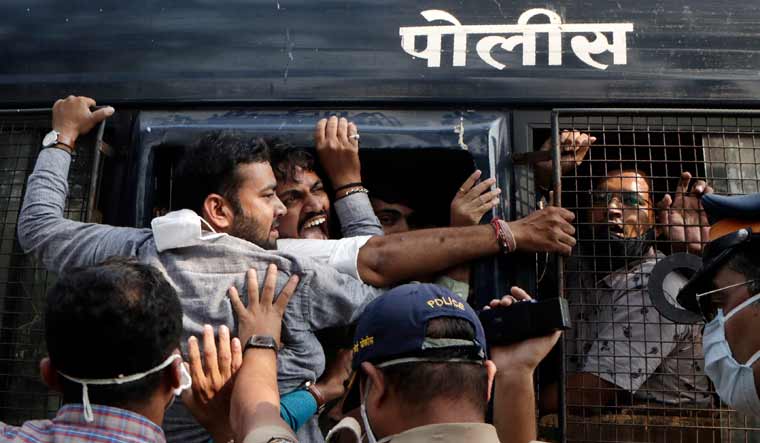 Police detain BJP workers protesting against Maharashtra state government for the arrest of television news anchor Arnab Goswami in Mumbai | PTI