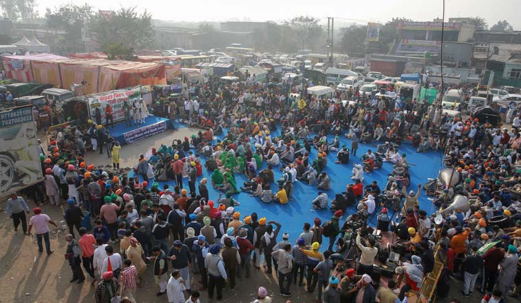 Farmers protest blocking a highway at the Singhu border between Delhi and Haryana  | AP