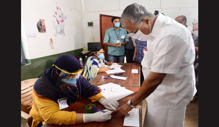 Kerala CM Pinarayi Vijayan casts his vote during the last stage of Kerala local body elections at Cherikkal in Kannur | PTI