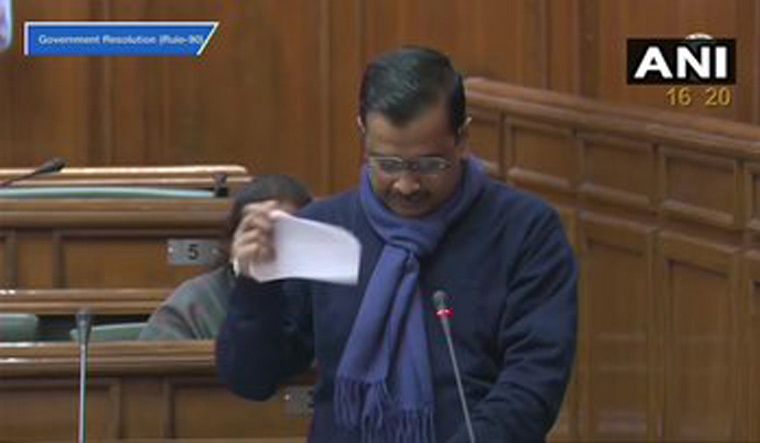 Arvind Kejriwal tears copies of the three farm laws in Vidhan Sabha | Twitter/ANI