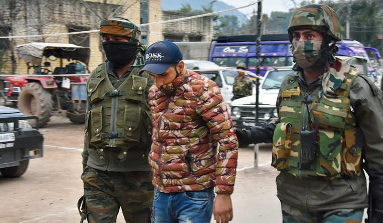 Army personnel take away a suspected associate of J&K Ghaznavi Force after busting of a terror module in Poonch district | PTI