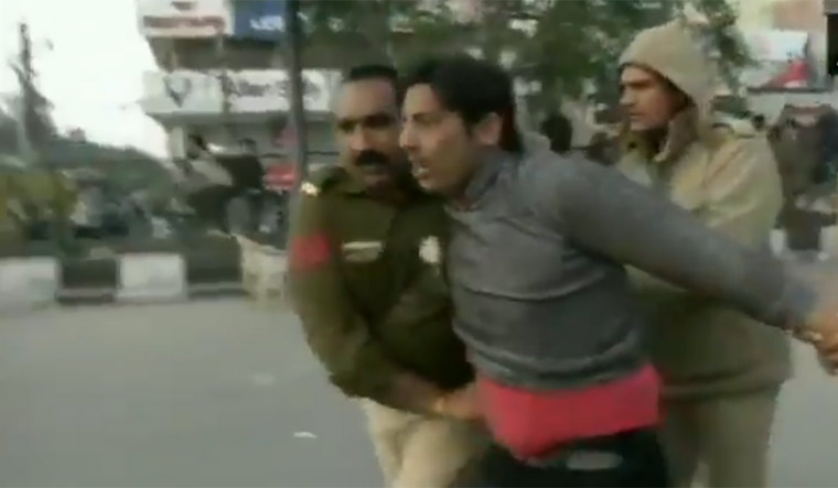 Man who fired bullets in Shaheen Bagh is being taken away from the spot by police | Video grab/Twitter/ANI