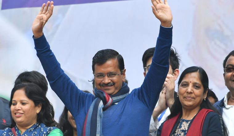 Delhi Chief Minister Arvind Kejriwal waves at party workers as they celebrate AAP victory in Delhi elections | Arvind Jain