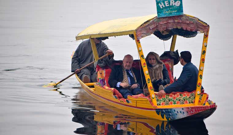 Envoys from foreign countries ride on shikara boat in Dal Lake in Srinagar on February 12 | AFP