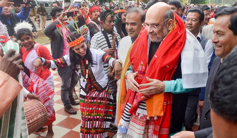 Artists perform as Union Home Minister Amit Shah arrives to attend the 34th Statehood Day of Arunachal Pradesh, in Lakhimpur Kheri district | PTI