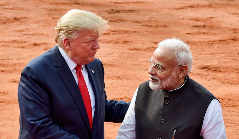 US President Donald Trump shakes hands with Prime Minister Narendra Modi | PTI