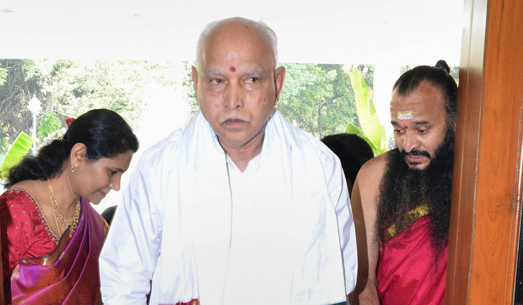 Karnataka Chief Minister B.S. Yediyurappa enters his official residence after performing rituals, in Kaveri | PTI