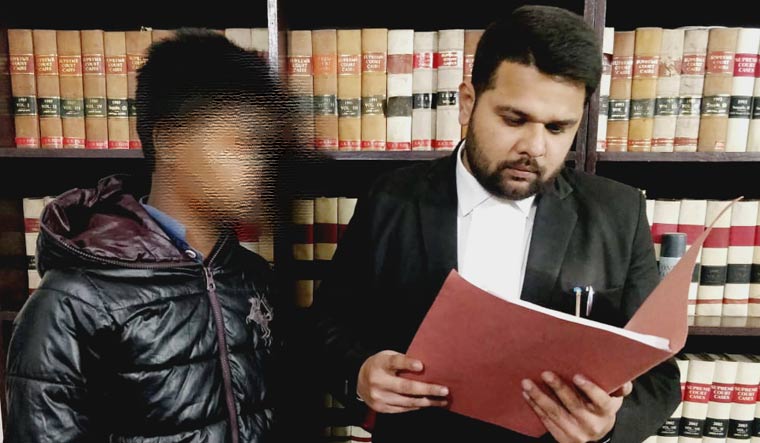 The minor boy (face blurred) with his lawyer Yashab Husain