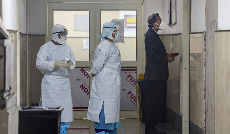 Medics wearing protective masks inside the novel coronavirus isolation ward of Government Medical College Hospital in Jammu | PTI