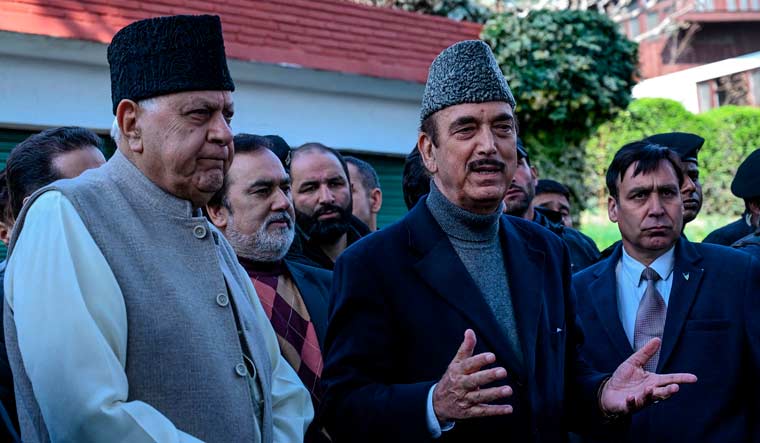 Former Jammu and Kashmir chief minister Farooq Abdullah and senior Congress leader Ghulam Nabi Azad speak to media at former's residence in Srinagar | AFP