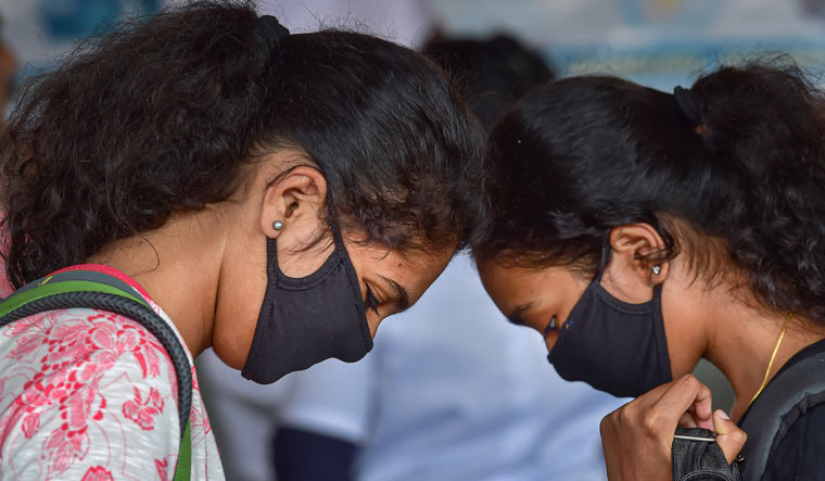 Passengers wearing masks in wake of coronavirus pandemic at Bengaluru City Railway Station | PTI