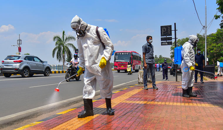 Disaster Response Force worker sprays disinfectant as a precaution against a coronavirus outbreak at public places, in Hyderabad | PTI