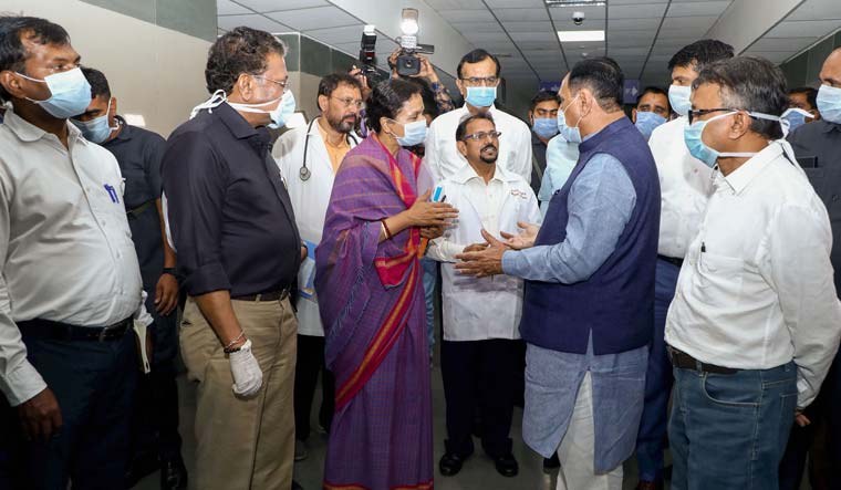 [File] Gujarat Chief Minister Vijay Rupani interacts with medics during his visit to the Civil Hospital, in Ahmedabad | PTI