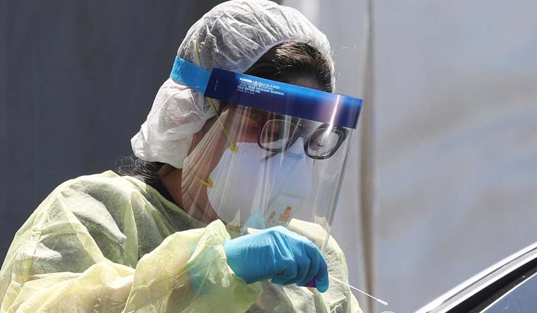 Under flak from doctors and public health experts for the PPE shortage, the government is going all out to procure masks, gloves, protective goggles and hazmat suits | Reuters