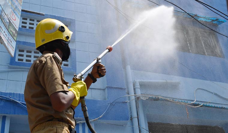 Disinfectant spray being used at a government quarters in Kolkata | Salil Bera