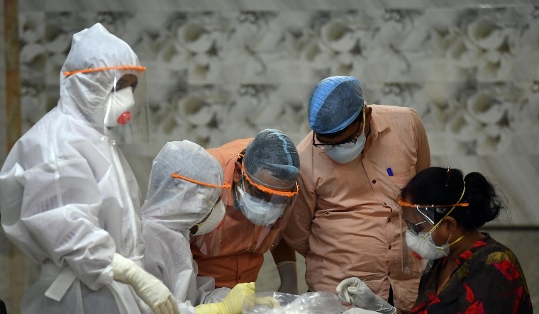 Representational image of health care professionals with protective gear | Salil Bera