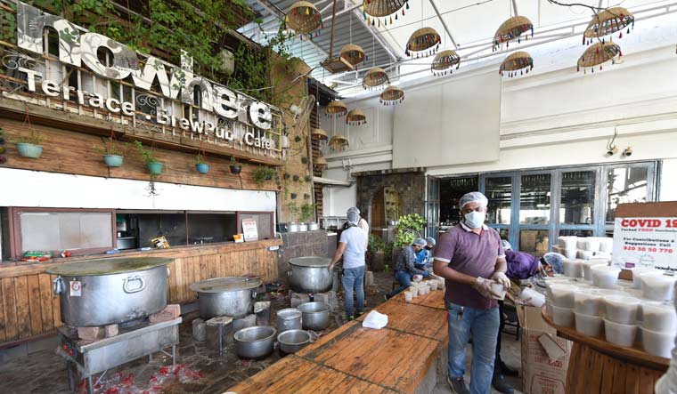 Food for distribution being prepared at 'Nowhere', a popular posh restaurant | Aayush Goel 