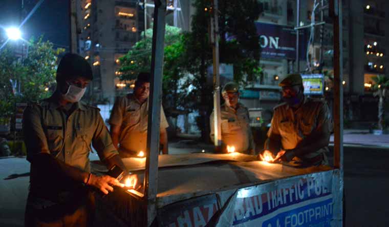 Policemen lighting lamps in Ghaziabad | Arvind Jain