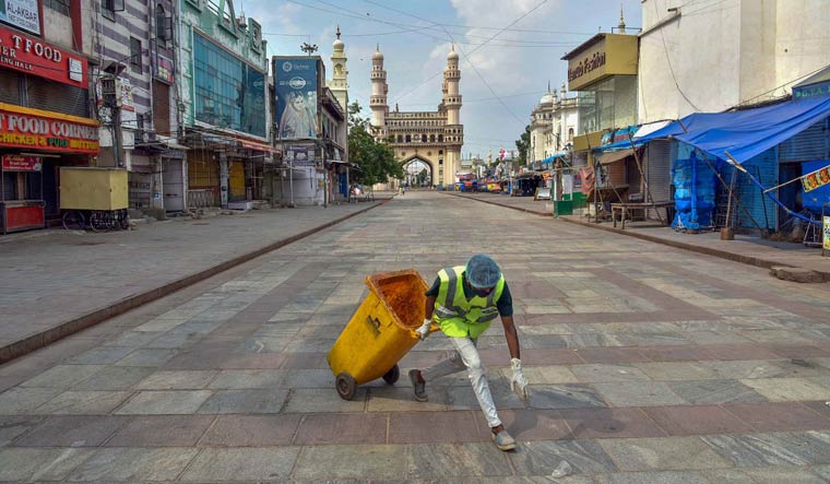 A GHMC worker cleans an area during the nationwide lockdown in the old city of Hyderabad | PTI