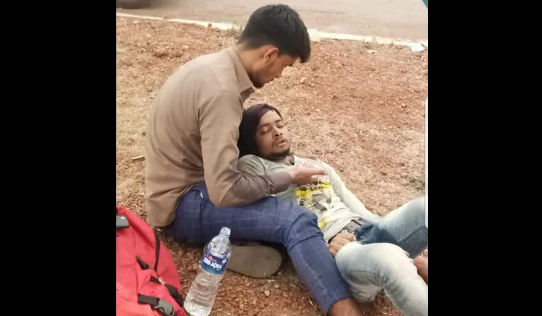 A photograph of a distraught Yaqoob, sitting by the roadside while cradling the head of a visibly ill Amrit in his lap, had gone viral on social media