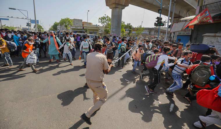 police-lathi-baton-charge-migrant-workers-rialway-ahmedabad-PTI